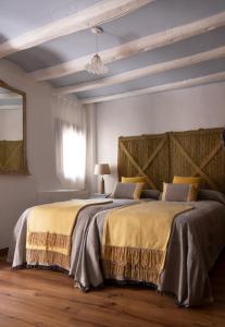 En eller flere senge i et værelse på Ca la Casilda