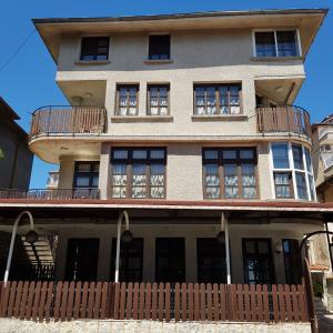 a building with a balcony on top of it at Slantse in Sozopol