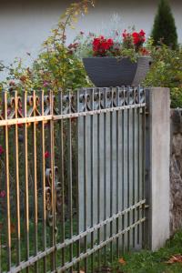 a metal fence with a potted plant on top of it at Eistvere Manor Accommodation in Eistvere