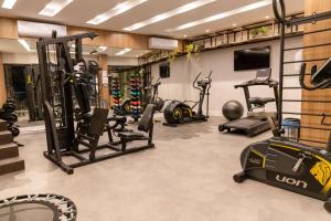 a gym with several exercise equipment in a room at Granterrara Hotel in Jequié