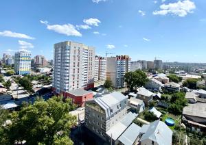 an aerial view of a city with tall buildings at Молодежная 136, ЦЕНТР города ЖК JAZZ in Barnaul