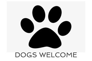 a black dog pawprint icon with the words dogs welcome at 50m FROM THE BEACH, dogs welcome in St Merryn