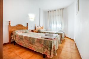 Posteľ alebo postele v izbe v ubytovaní Apartaments Palamós - Pal Beach