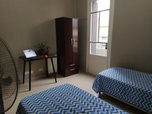 Postel nebo postele na pokoji v ubytování HA! 1 Resi para estudiantes