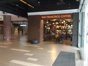 a restaurant with a sign that reads san francisco coffee at KLGateway Premium Residence Mid Valley in Kuala Lumpur