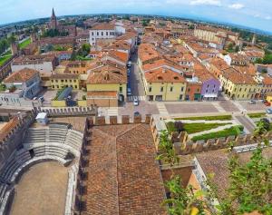 an aerial view of a city with buildings and roofs at The Comfort Apartment in Montagnana +5 photos