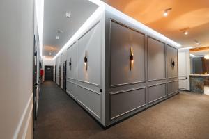 a hallway with gray lockers in a building at Hotel Classic in Kyiv