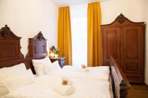 Heritage Boutique Apartments Bad Ischl 객실 침대