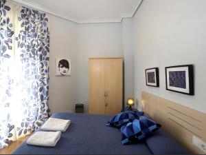 Cama o camas de una habitación en Reino de Valencia Apartments