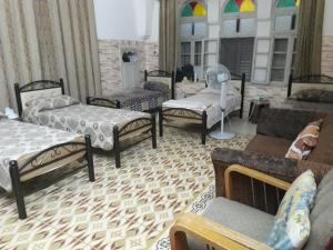 En eller flere senger på et rom på Soufan Guest HOUSE