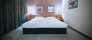 Postel nebo postele na pokoji v ubytování Hotel Ca' Brugnera + 7 fotografií
