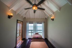 Rúm í herbergi á COCOS Hotel Antigua - All Inclusive - Adults Only