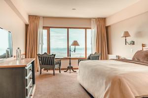 Cama ou camas em um quarto em Wyndham Garden Ushuaia Hotel del Glaciar