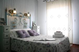 Cama o camas de una habitación en Alojamiento y habitacionesla cañada monfrague