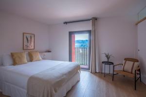 Posteľ alebo postele v izbe v ubytovaní Hotel Rural Mas de l'Illa