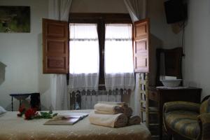 Cama o camas de una habitación en Alojamiento y habitacionesla cañada monfrague