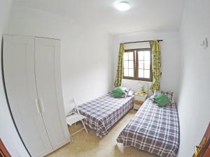 Posteľ alebo postele v izbe v ubytovaní Casa El Cercado