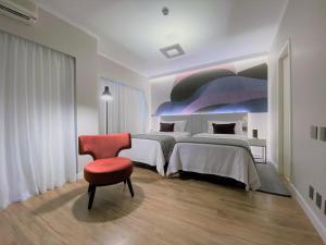 Letto o letti in una camera di Clarion Faria Lima