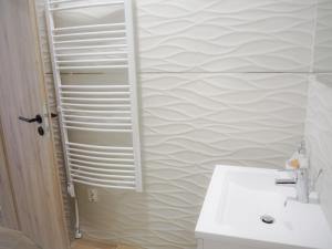 Kúpeľňa v ubytovaní Holiday Apartmanház