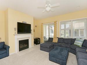 a living room with a couch and a fireplace at Bayside Resort - 36477 Wild Rose in Selbyville