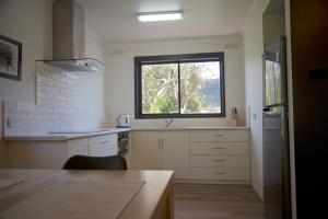 a kitchen with a sink and a window at 151 Grampians Road in Halls Gap