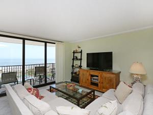 a living room with a white couch and a flat screen tv at Sea Colony Edgewater House VI in Bethany Beach