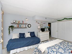 a bedroom with a blue bed and a white dresser at Sea Colony Annapolis House II in Bethany Beach +27 photos