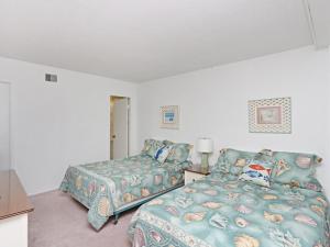 a living room with a bed and a couch at Sea Colony Brandywine House II in Bethany Beach