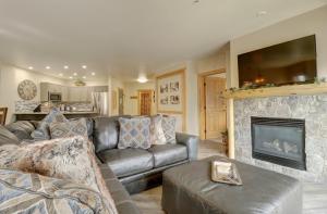 a living room with a couch and a fireplace at Cs302 Copper Springs Condo in Copper Mountain