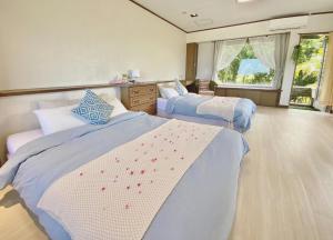 Cama ou camas em um quarto em イリワ -stay&coffee iriwa-