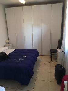 A bed or beds in a room at Casa di Alfredo Affittacamere