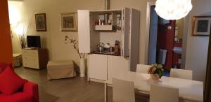 Televízia a/alebo spoločenská miestnosť v ubytovaní Agorà Residenza