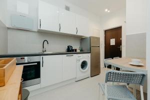 Virtuvė arba virtuvėlė apgyvendinimo įstaigoje ShortStayPoland Piękna (B20)