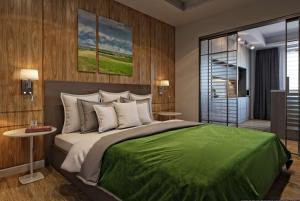 Wyndham Garden Astana tesisinde bir odada yatak veya yataklar