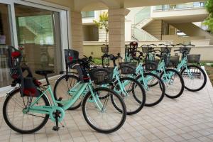 bicycles parked in front of a building at Residence I Diamanti in Cervia