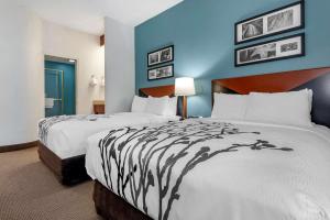Postel nebo postele na pokoji v ubytování Sleep Inn + 23 fotografií