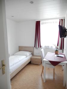 Ένα ή περισσότερα κρεβάτια σε δωμάτιο στο Hotel "Wilder Mann"