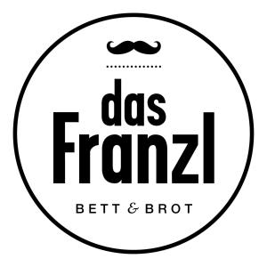 a label for a business with a mustache and a bow tie at Das Franzl - Bett & Brot in St. Wolfgang