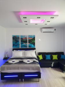 Posteľ alebo postele v izbe v ubytovaní Smaragd apartman