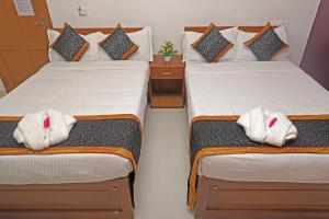 Säng eller sängar i ett rum på Kumaran Kudil - New Family Home Stay VL Bodinayakkanur, Theni