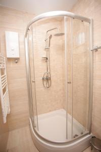 a shower with a glass door in a bathroom at Gorštak-Šeha in Jahorina +28 photos