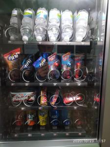 a refrigerator filled with lots of different types of drinks at Hotel Europa in Tomelloso