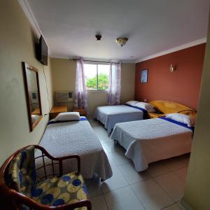 Krevet ili kreveti u jedinici u objektu Hotel Toledo