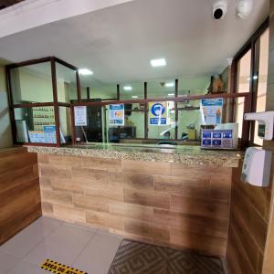 a fast food restaurant with a counter in a store at Hotel Toledo in David