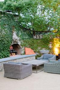 a stone wall with a bench and a fireplace at Seven Branches Venue and Inn in Sonoma