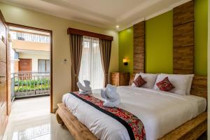 Ein Bett oder Betten in einem Zimmer der Unterkunft Mejore Beach Hotel