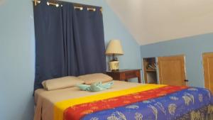 Letto o letti in una camera di Roatan Backpackers' Hostel