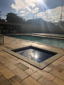 Πισίνα στο ή κοντά στο Vivendas de Iguaba