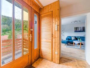 a pivot door in a house with a living room at Apartment near the ski area in Zorge in Zorge
