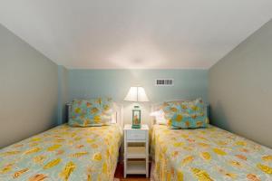 En eller flere senge i et værelse på Sea Colony Chesapeake House IV